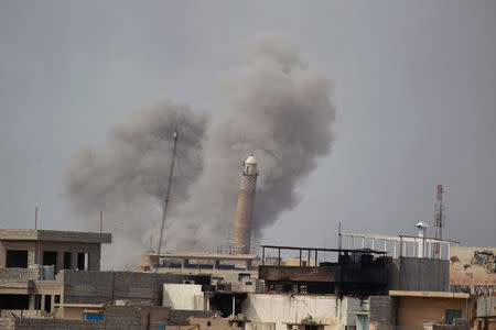 Smoke rises from clashes during a battle between Iraqi forces and Islamic State militants, in Mosul. REUTERS/Khalid al Mousily