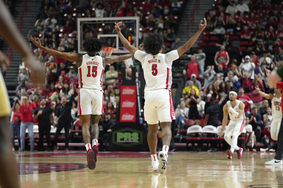 UNLV guard Luis Rodriguez (15) and guard Rob Whaley Jr. (5) celebrate after scoring against Colorado State during the first half of an NCAA college basketball game Saturday, Feb. 24, 2024, in Las Vegas. (AP Photo/Lucas Peltier)