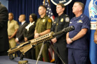 A Barrett 50 caliber rifle is displayed during a news conference at the Homeland Security Investigations Miami Field Office (HSI), Wednesday, Aug. 17, 2022, in Miami. HSI is working with other agencies to highlight efforts to crack down on a recent increase of firearms and ammunition smuggling to Haiti and other Caribbean nations. (AP Photo/Lynne Sladky)