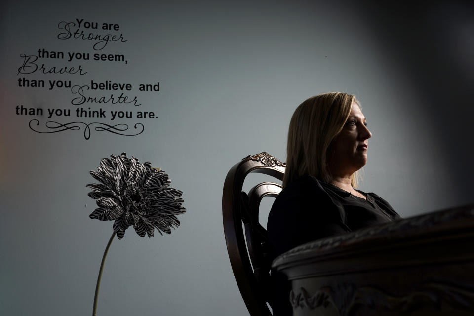 Tina Meier, founder of the Megan Meier Foundation, poses for a photo in the foundation's office Wednesday, Dec. 8, 2021, in St. Charles, Mo. Meier's daughter, Megan, committed suicide in 2007 at the age of 13 after being harassed by a "friend" on MySpace who later turned out to be the mother of a classmate who was using the fake account to bully the unsuspecting teen. (AP Photo/Jeff Roberson)