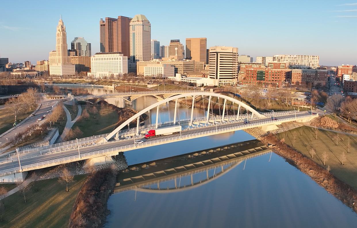 A truck goes over the Main Street bridge over the Scioto River on a Sunday afternoon. Many places will be closed or have alternate hours on Monday for Presidents Day.