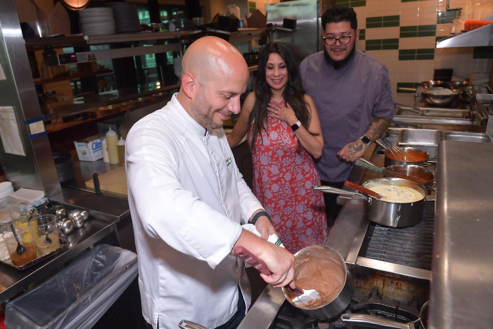 Chef Fernando Coppola, Director of Culinary & Beverage, of the Juniper restaurant in downtown Greenville works on a dish.