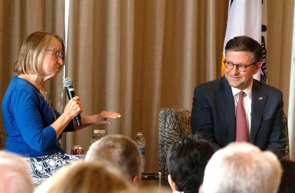 Congresswoman Mariannette Miller-Meeks, left, asks a question of Speaker of the House Mike Johnson Sunday, April 28, 2024 at the Courtyard by Marriott in Iowa City, Iowa.