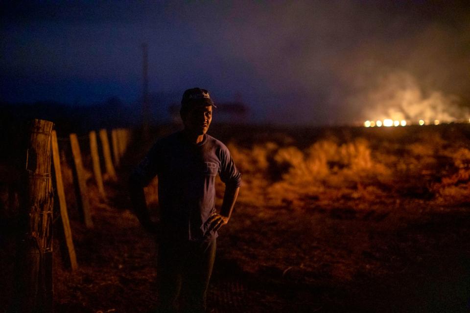 Brazilian Neri dos Santos, 48, looks at a fire at the farm where he works in Nova Santa Helena municipality, Mato Grosso state, in the Amazon basin, Brazil, on Aug. 23, 2019. (Photo: Joao Laet/AFP/Getty Images)