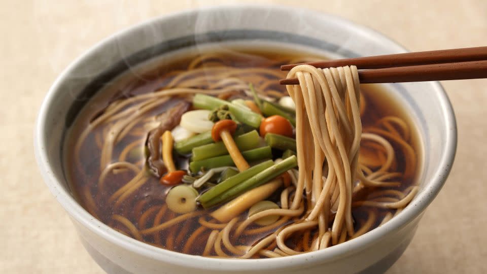 Many Japanese slurp down bowls of delicious Soba noodles to welcome the new year. - Nishihama/Shutterstock