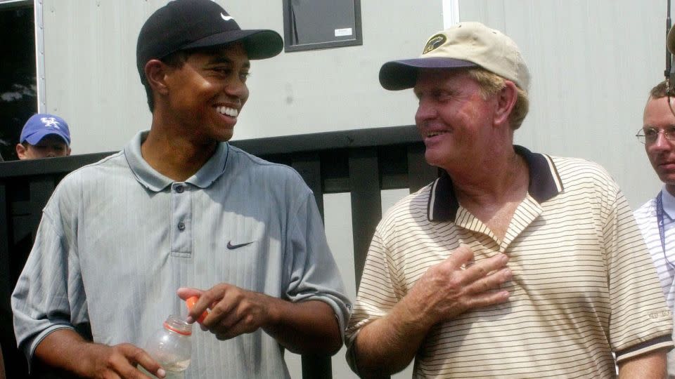One more Masters win would see Woods (pictured, 2000) tie Nicklaus (right) with six wins at Augusta National. - Dave Martin/AP