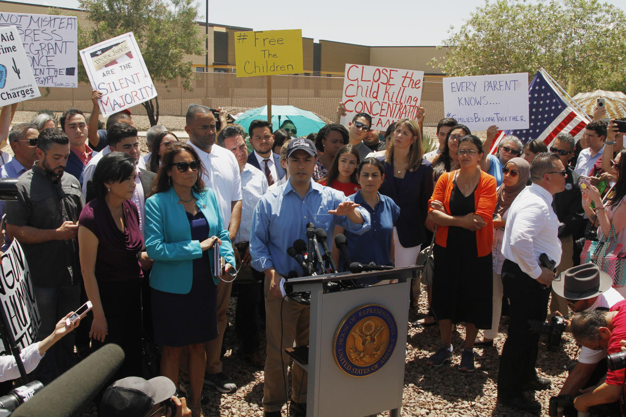 Rep. Joaquin Castro alongside members of the Hispanic Caucus after touring the Border Patrol station in Clint, Texas, on July 1. Castro's identical twin, presidential candidate Julián Castro, held a rally outside the building over the weekend. (Photo: AP/Cedar Attanasio)