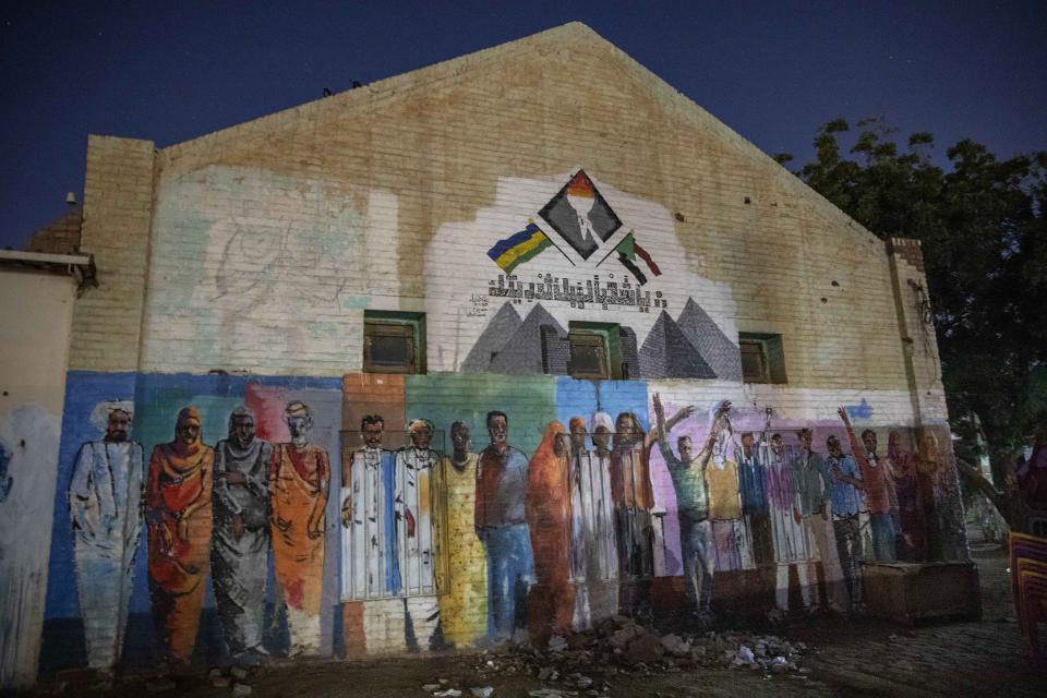 This Jan. 12, 2020 photo shows, graffiti drawn during last years' revolution, in Khartoum, Sudan. The young protesters who led the uprising against former President Omar al-Bashir, are now caught in the limbo of the country's fragile interim period. They say they've lost trust in the generals leading the country after a brutal crackdown on their sit-in last summer by security forces that killed dozens. (AP Photo/Nariman El-Mofty)