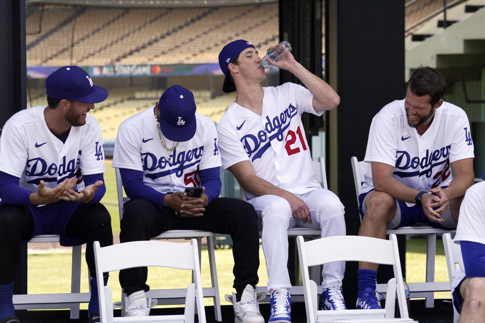 Members of the Los Angeles Dodgers, from left,Cody Bellinger, Mookie Betts, Walker Buehler and Clayton Kershaw listen during an event to officially launch the countdown to MLB All-Star Week Tuesday, May 3, 2022, at Dodger Stadium in Los Angeles. The All-Star Game is scheduled to be played on July 19. (AP Photo/Mark J. Terrill)