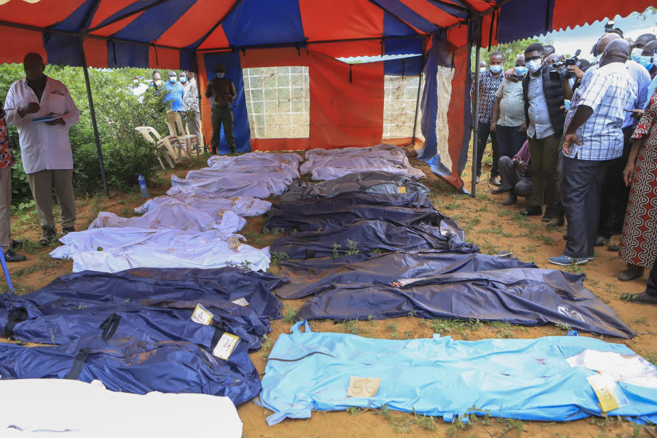 Body bags are laid out at the scene where dozens of bodies have been found in shallow graves in the village of Shakahola, near the coastal city of Malindi, in southern Kenya Monday, April 24, 2023. Kenya's president William Ruto said Monday that the starvation deaths of dozens of followers of pastor Paul Makenzi, who was arrested on suspicion of telling his followers to fast to death in order to meet Jesus, is akin to terrorism. (AP Photo)