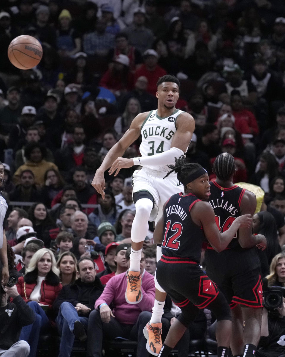 Milwaukee Bucks' Giannis Antetokounmpo (34) passes the ball during the first half of an NBA basketball game against the Chicago Bulls, Thursday, Feb. 16, 2023, in Chicago. (AP Photo/Charles Rex Arbogast)