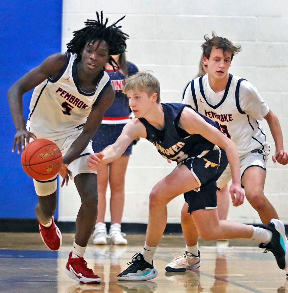 Titan #5 Gerald Ellison has the ball knocked from his hands by Hawks #13 Ryan Mutschler.
The Pembroke Titans hosted Hanover Hawks in boys basketball action Friday Jan. 19, 2024