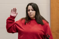 Kayla Montgomery is sworn in by prosecutor Christopher Knowles before testifying at the trial of Adam Montgomery at Hillsborough County Superior Court in Manchester, N.H, on Friday, Feb. 9, 2024. Adam Montgomery is accused of killing his 5-year-old daughter and spending months moving her body before disposing of it. (Jeffrey Hastings/Pool Photo via AP)