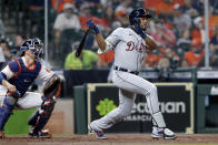 Detroit Tigers' Jeimer Candelario watches his two run RBI hit in front of Houston Astros catcher Jason Castro, left, during the fourth inning of a baseball game Wednesday, April 14, 2021, in Houston. (AP Photo/Michael Wyke)