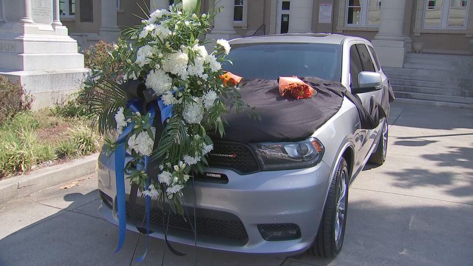 The community left flowers on Anson County Sheriff Landric Reid's patrol car after he died Wednesday.