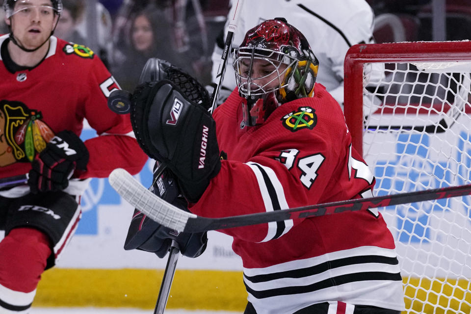 Chicago Blackhawks goaltender Petr Mrazek saves a shot against the Los Angeles Kings during the first period of an NHL hockey game in Chicago, Sunday, Jan. 22, 2023. (AP Photo/Nam Y. Huh)
