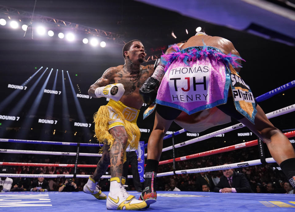 Gervonta Davis, left, hits Mario Barrios during the WBA Super Lightweight world championship boxing match on Saturday, June 26, 2021, in Atlanta. Davis won. (AP Photo/Brynn Anderson)