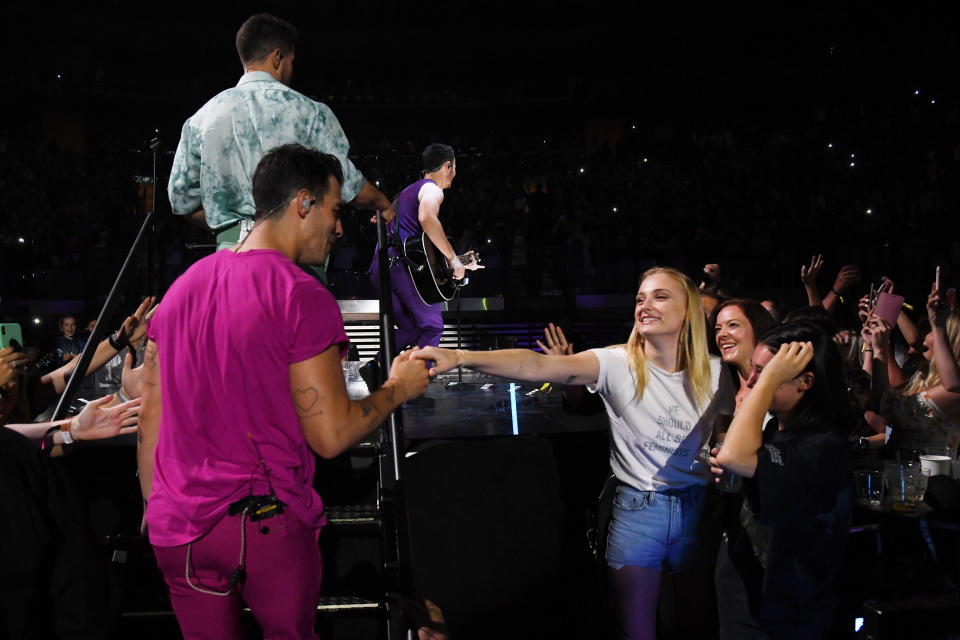 Joe performing with Sophie in the audience