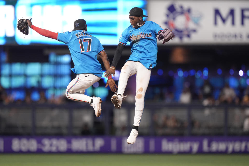 Miami Marlins shortstop Vidal Brujan (17) and center fielder Nick Gordon celebrate after the Marlins beat the Seattle Mariners 6-4, during a baseball game, Sunday, June 23, 2024, in Miami. (AP Photo/Wilfredo Lee)