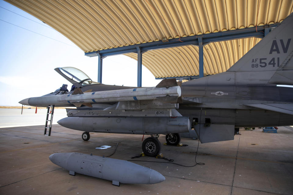 FILE - Weapons are loaded on a U.S. F-16 fighter jet as it prepares to take part in the African Lion military exercise, in Ben Guerir, Morocco, June 14, 2021. President Joe Biden on Friday, May 19, 2023, endorsed plans to train Ukrainian pilots on U.S.-made F-16 fighter jets, according to two people familiar with the matter, as he huddled with allies at the Group of Seven summit on how to bolster support for Kyiv against Russia's invasion. (AP Photo/Mosa'ab Elshamy, File)