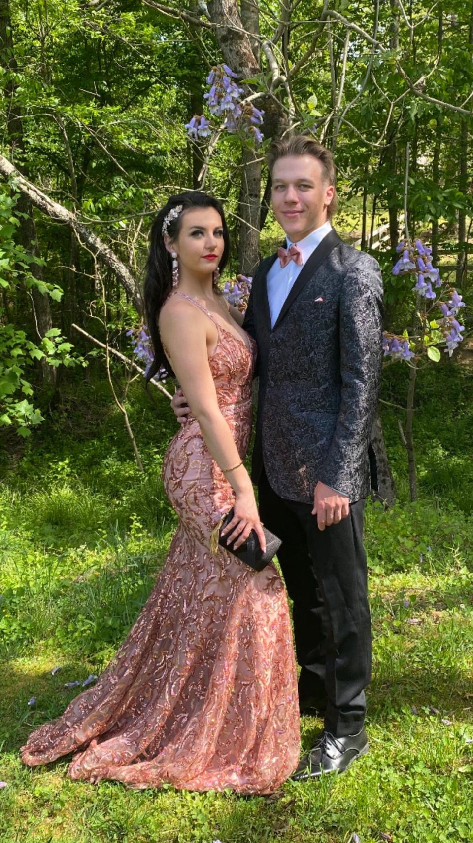 Isabella Killough and her boyfriend Tyler Alewine pose in what would have been their prom outfits.