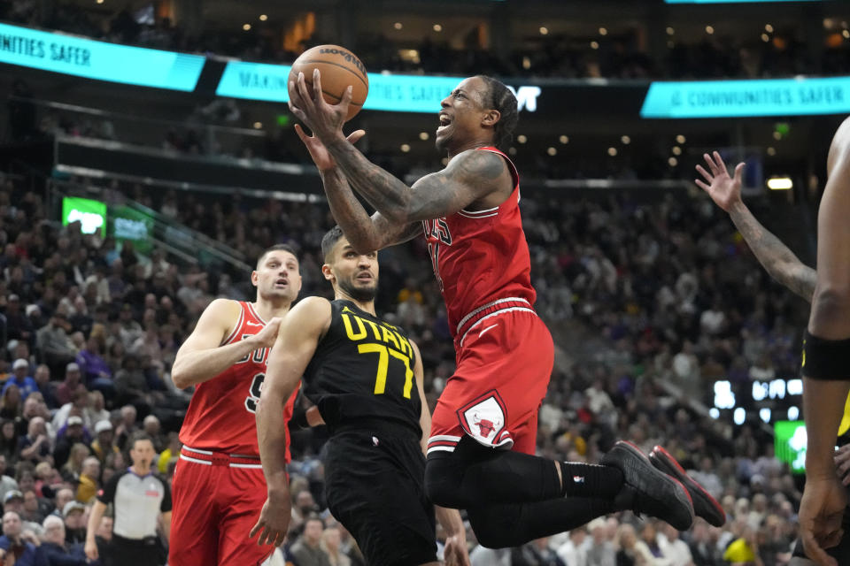 Chicago Bulls forward DeMar DeRozan, right, goes to the basket as Utah Jazz center Omer Yurtseven (77) defends during the second half of an NBA basketball game Wednesday, March 6, 2024, in Salt Lake City. (AP Photo/Rick Bowmer)