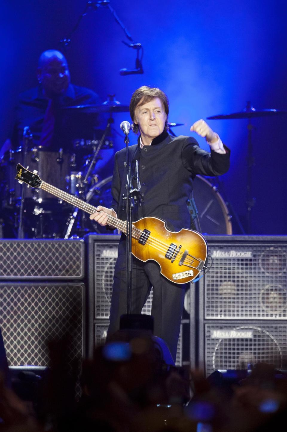 FILE - In this Wednesday, Dec. 14, 2011 file photo, Sir Paul McCartney performs on stage during his "Good Evening Europe" European Tour, his first since 2003, at Olympic Hall in Moscow, Russia. Former Beatle Paul McCartney has asked a Russian judge to release members of the Pussy Riot punk group from prison. In letters dated Monday and posted online by the group's supporters, McCartney asks for parole to be granted to Maria Alekhina and Nadezhda Tolokonnikova, currently serving two-year sentences for an impromptu protest in Moscow's main cathedral. (AP Photo/Alexander Zemlianichenko, file)