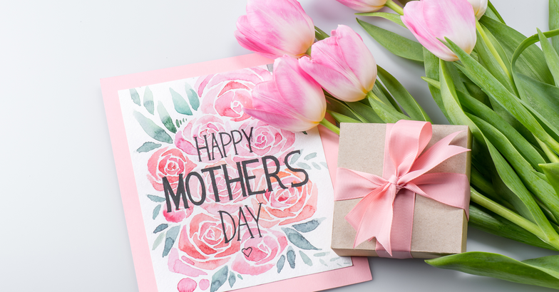 Mother's Day card with small present and flowers