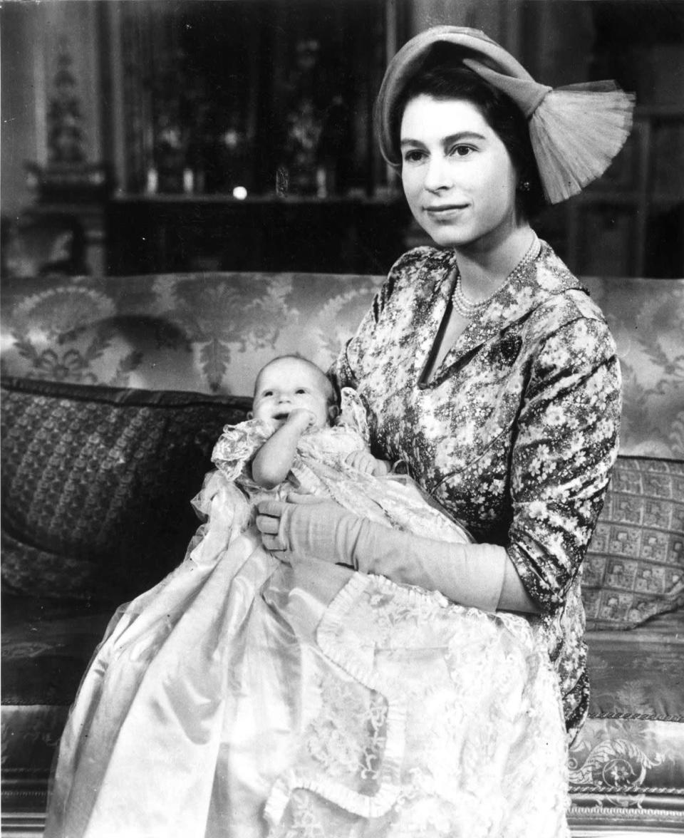 <p>Princess Elizabeth holds Princess Anne, who is wearing the Royal christening robe.</p>