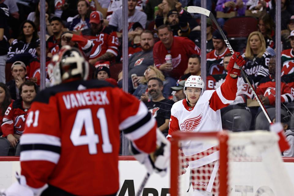 Red Wings left wing Jakub Vrana reacts after scoring a goal past Devils goaltender Vitek Vanecek in the second period Oct. 15, 2022, in Newark, New Jersey.