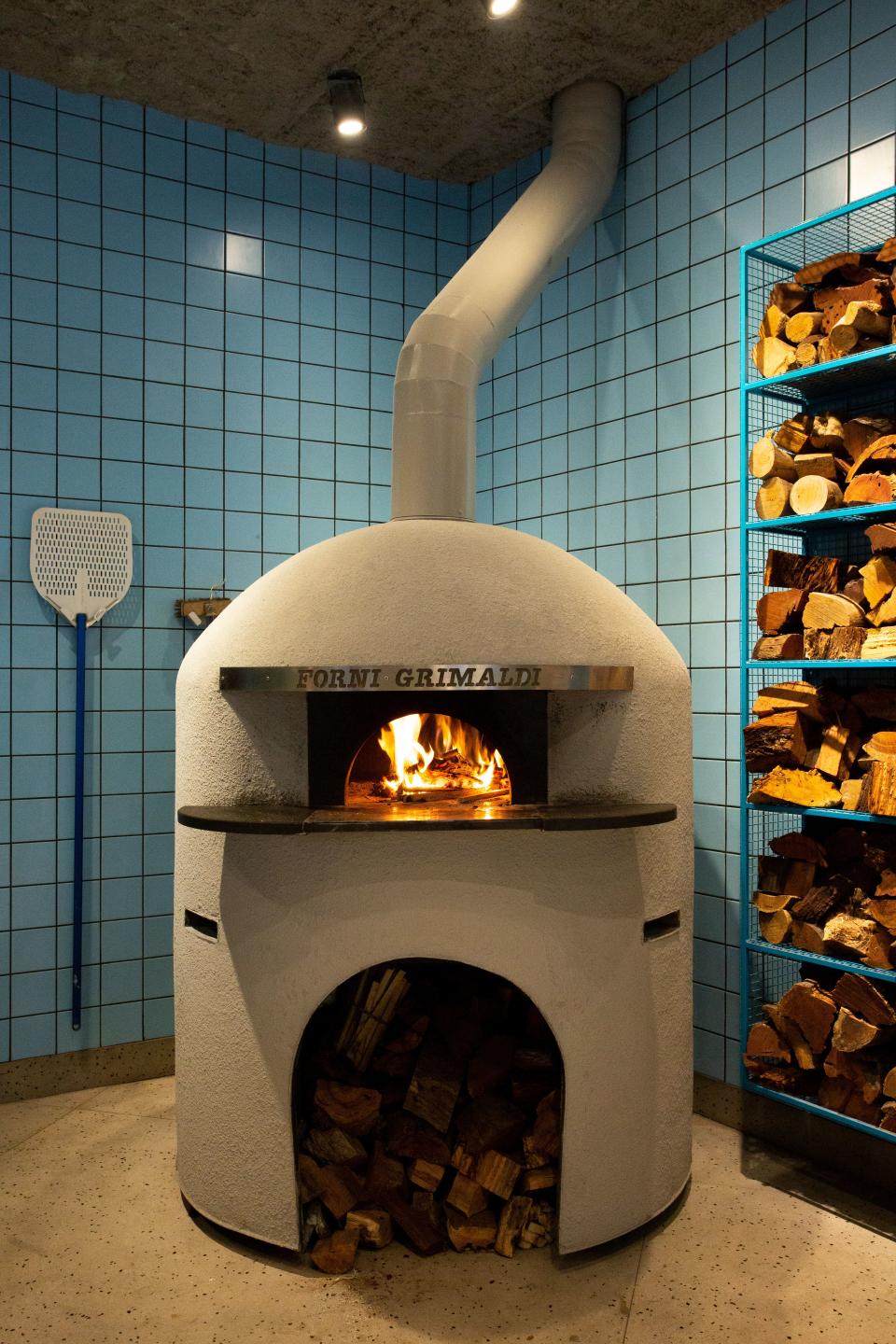 That Forni Grimaldi pizza oven takes center stage.