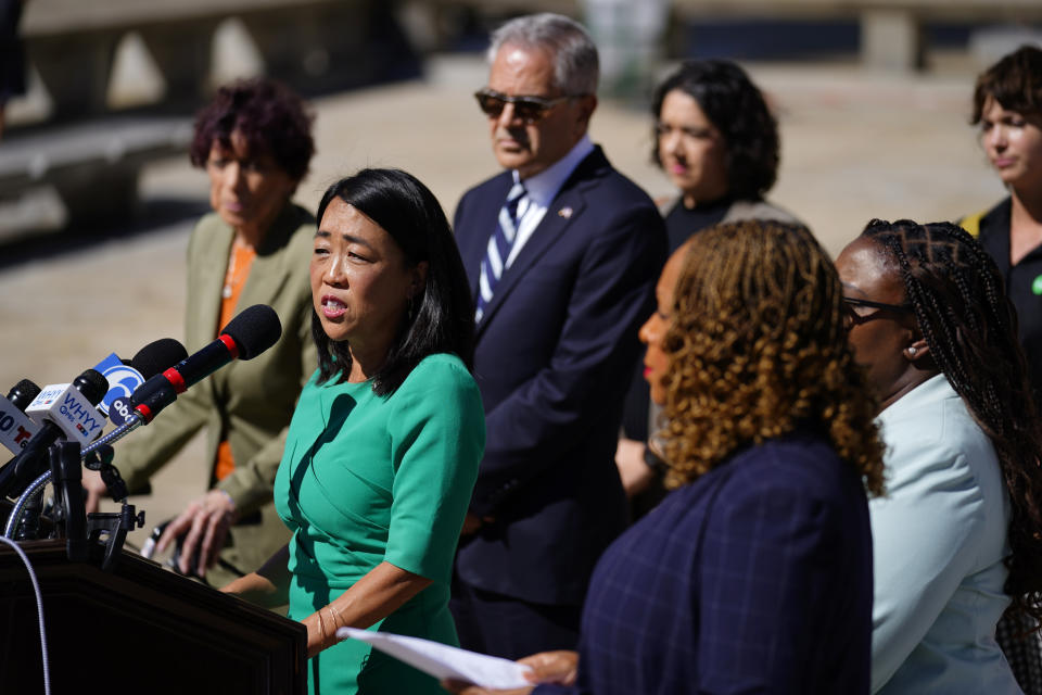 Philadelphia Councilmember Helen Gym, at podium, speaks with members of the media during a news conference in Philadelphia, Wednesday, Sept. 14, 2022. A handful of Philadelphia City Councilmembers announced plans Wednesday to introduce legislation aimed at protecting access to abortions inside city limits— including a bill the lawmakers said would give Philadelphia one of the strongest privacy protection laws in the country. (AP Photo/Matt Rourke)