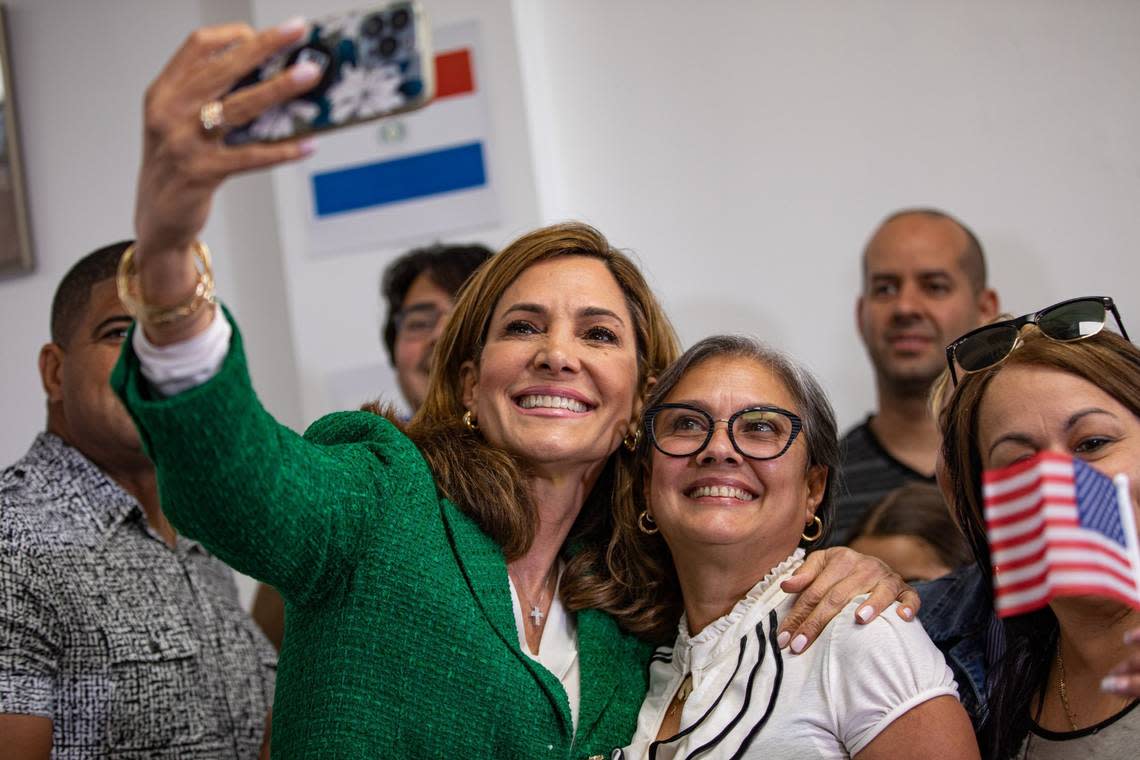 U.S. Rep. Maria Elvira Salazar (left) takes a selfie with Nerelys Caballero (right) at the RNC Hispanic Community Center in Doral, Florida, on Tuesday, Oct. 4, 2022.