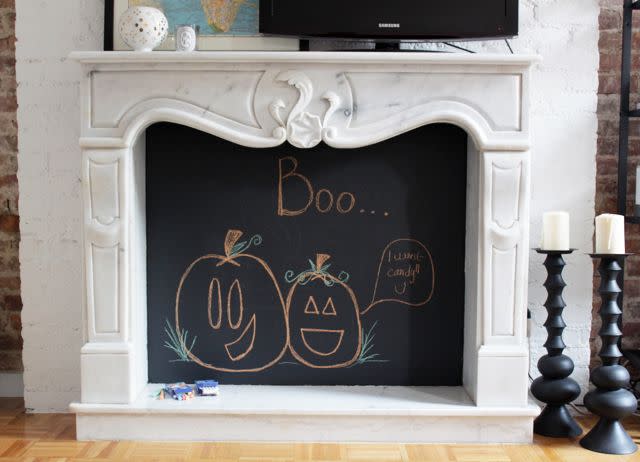 <p>Alicia Lund of <a href="https://cheetahisthenewblack.com/uncategorized/diy-chalkboard-fireplace/" rel="nofollow noopener" target="_blank" data-ylk="slk:Cheetah Is the New Black;elm:context_link;itc:0;sec:content-canvas" class="link ">Cheetah Is the New Black</a> swathed the interior of her decorative marble fireplace in two coats of Benjamin Moore's <a href="https://www.housebeautiful.com/home-remodeling/diy-projects/a27287825/chalkboard-paint/" rel="nofollow noopener" target="_blank" data-ylk="slk:chalkboard paint.;elm:context_link;itc:0;sec:content-canvas" class="link ">chalkboard paint.</a> Then, she drew a fun Halloween scene to work as a nice backdrop. </p><p><a class="link " href="https://www.amazon.com/Renaissance-Chalk-Finish-Paint-Eco-Friendly/dp/B06VX1PLSQ/ref=asc_df_B06VX1PLSQ/?tag=syn-yahoo-20&ascsubtag=%5Bartid%7C10057.g.2554%5Bsrc%7Cyahoo-us" rel="nofollow noopener" target="_blank" data-ylk="slk:BUY NOW;elm:context_link;itc:0;sec:content-canvas">BUY NOW</a> <strong><em>Chalk Finish Paint, $20</em></strong></p>