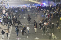 Israeli police disperse demonstrators blocking a highway during a protest against plans by Prime Minister Benjamin Netanyahu's government to overhaul the judicial system in Tel Aviv, Israel, Monday, March 27, 2023. Tens of thousands of Israelis have poured into the streets across the country in a spontaneous outburst of anger after Prime Minister Benjamin Netanyahu abruptly fired his defense minister for challenging the Israeli leader's judicial overhaul plan. (AP Photo/Oren Ziv)