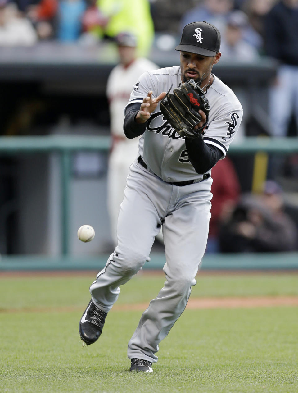 Chicago White Sox's Marcus Semien drops a ball for an error from Cleveland Indians' David Murphy in the second inning of a baseball game, Saturday, May 3, 2014, in Cleveland. Murphy was safe at first base. Lonnie Chisenhall scored on the play. (AP Photo/Tony Dejak)