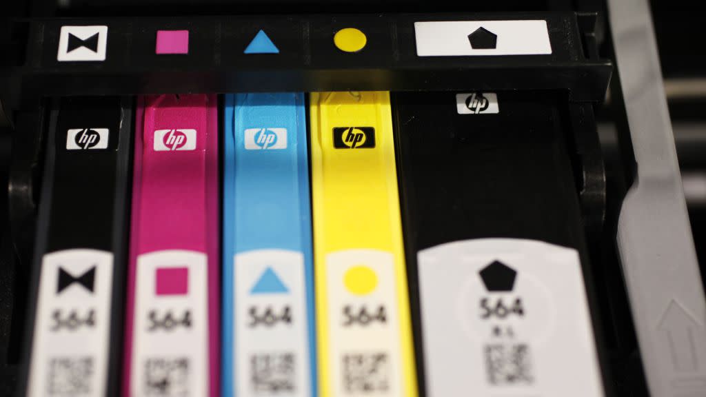 Hewlett Packard printer inks are seen inside an HP printer on display at Best Buy in Mountain View, Calif., Monday, May 18, 2009. Hewlett-Packard Co. on Tuesday said its quarterly profit dropped 17 percent as sales of personal computers and printer ink slumped. The numbers were still in line with Wall Street's forecasts. (AP Photo/Paul Sakuma)