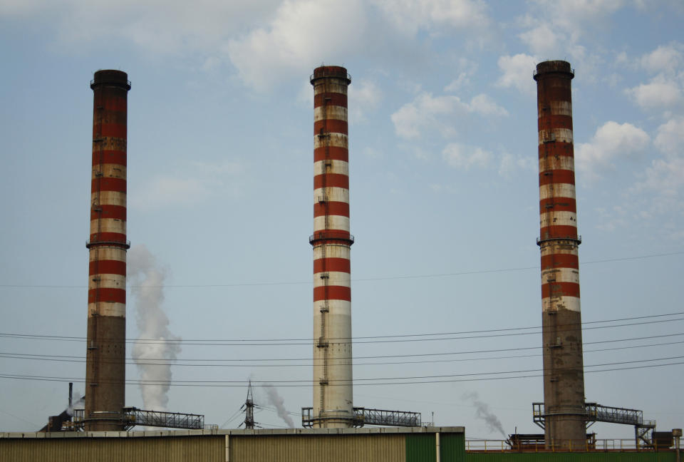 In this picture taken Friday, Aug. 17, 2012, Italy's largest steel plant is seen in Taranto, Italy. Italian Premier Giuseppe Conte says steelmaker ArcelorMittal has agreed to try for a negotiated solution over the fate of a southern Italian steel plant. Conte and his economy and economic development ministers held four-hour talks ending Friday before midnight with ArcelorMittal’s top executives. Union leaders on Saturday insisted that any deal must exclude layoffs. (AP Photo/Paola Barisani)