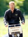 <p>Prince Harry rides around Sportcampus Zuiderpark on an Invictus Games bicycle. </p>