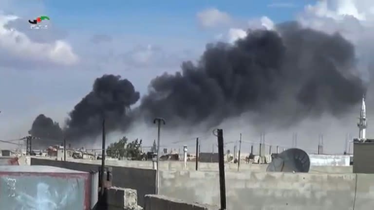 An image grab taken from a video released by the Homs Media Center on September 30, 2015 shows smoke billowing from buildings in the central Syrian town of Talbisseh in Homs province