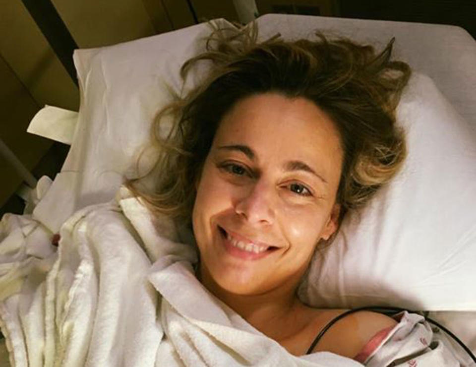 Kristie Holmes in bed after suffering a heart attack.