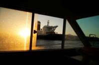 Iranian oil tanker Adrian Darya 1, previously named Grace 1, is pictured from windows as it sits anchored after the Supreme Court of the British territory lifted its detention order, in the Strait of Gibraltar