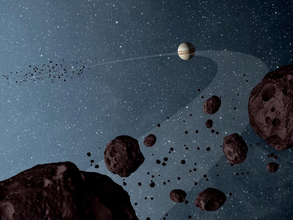 trojan asteroids illustration rocks in space leading and following jupiter