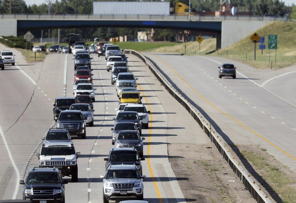 FILE - Heavy traffic moves slowly along Interstate 80 in Cheyenne, Wyo., on Monday, Aug. 21, 2017. Wyoming was one of the states in the path of the total eclipse, and thousands of people poured into the state for the view, causing massive traffic jams that are normally seen in major metropolitan areas. (Blaine McCartney/The Wyoming Tribune Eagle via AP, File)