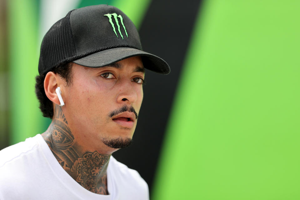 Nyjah Huston in a black-and-green "Monster" hat