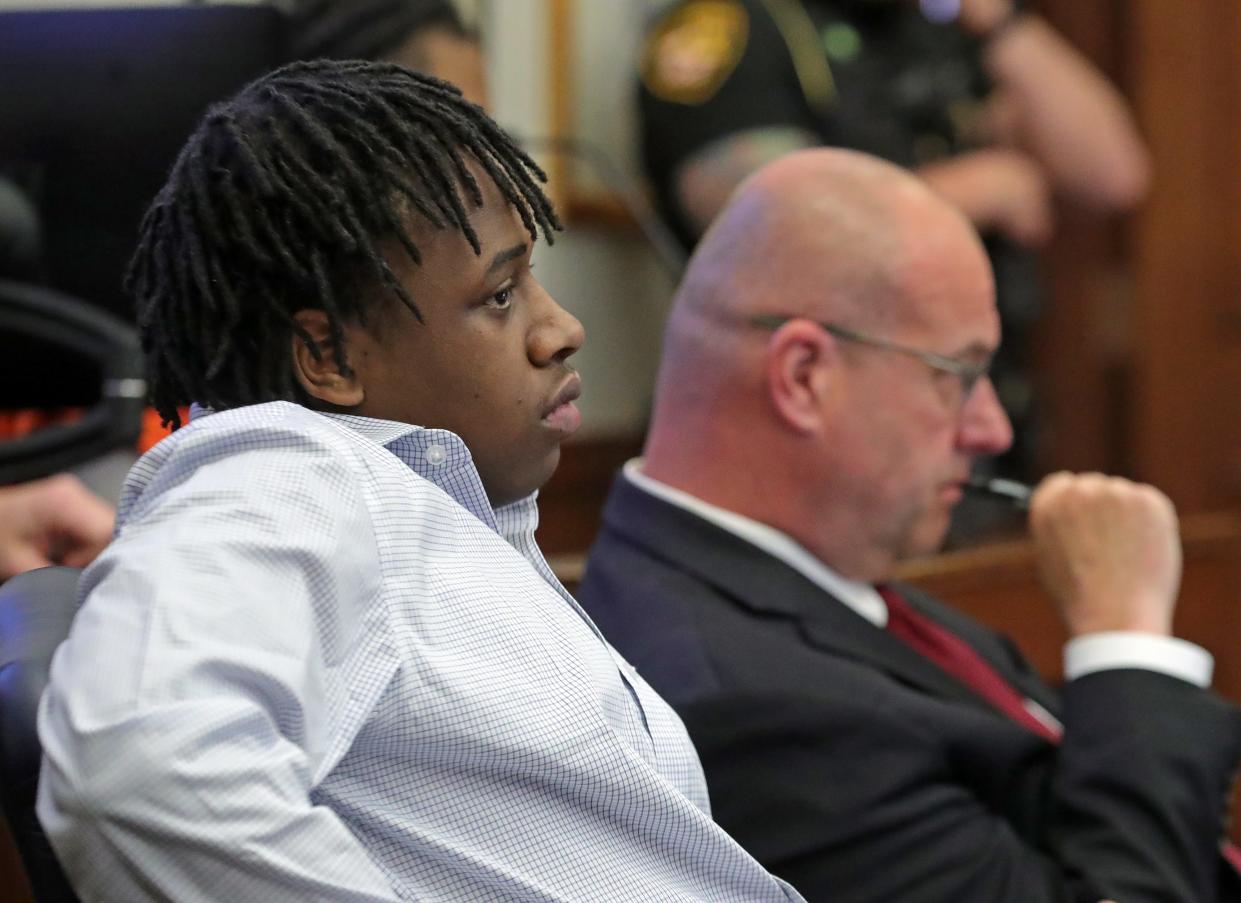 Cameron Jones, left, and attorney Erik Jones listen to proceedings Wednesday during Cameron Jones' trial in the New Year's Eve 2022 fatal shooting of Demarcus Hartwell in Summit County Common Pleas Court in Akron.