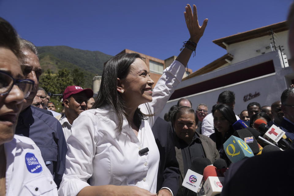 Opposition coalition presidential hopeful Maria Corina Machado waves to supporters after giving a press conference outside her campaign headquarters in Caracas, Venezuela, Monday, Jan. 29, 2024, days after the country's highest court upheld a ban on her candidacy. (AP Photo/Ariana Cubillos)