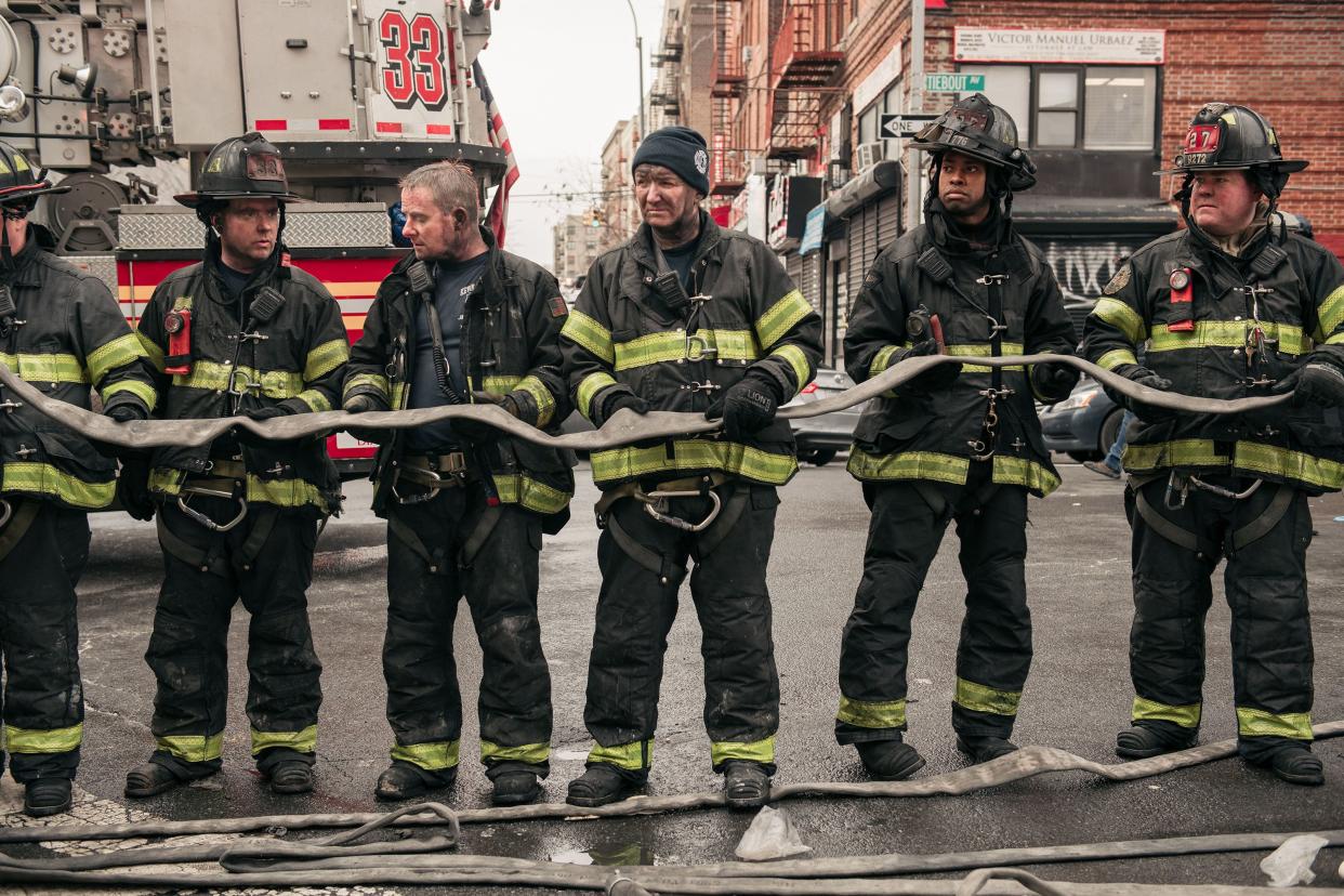 Emergency first responders remain at the scene after an intense fire at a 19-story residential building that erupted in the morning on Jan. 9, 2022, in the Bronx borough of New York City. Reports indicate over 50 people were injured.
