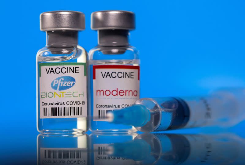 FILE PHOTO: Picture illustration of vials with Pfizer-BioNTech and Moderna coronavirus disease (COVID-19) vaccine labels