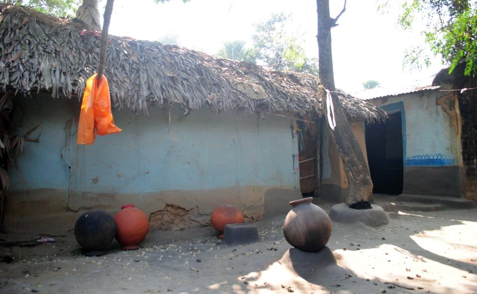 Empty vessels lie in the courtyard of the home of the woman who was gang raped, allegedly on the direction of a village council at Subalpur village, in Birbhum district, about 180 kilometers (110 miles) north of Kolkata, the capital of the eastern Indian state of West Bengal, Friday, Jan. 24, 2014. The woman told police that Monday's attack came as punishment for falling in love with a man from a different community and religion. The case has brought fresh scrutiny to the role of village councils, common in rural Indian, which decide on social norms in the village. (AP Photo)